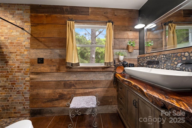64 Persimmon Hill Dr Unit 4, Columbus, NC 28722 - bathroom featuring wood walls, vanity, and toilet