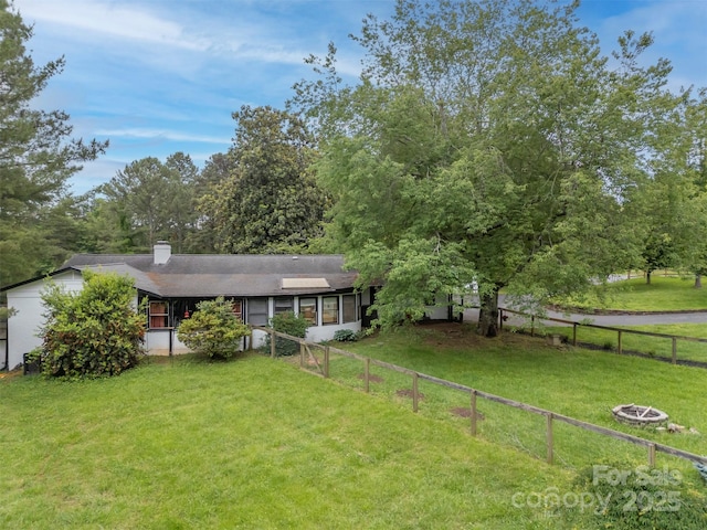 64 Persimmon Hill Dr Unit 4, Columbus, NC 28722 - view of front facade with a fire pit and a chimney