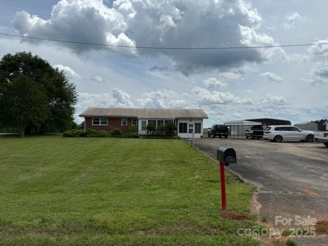 2165 Mccraw Rd, Mooresboro, NC 28114 - single story home with a detached carport, a front lawn, and driveway