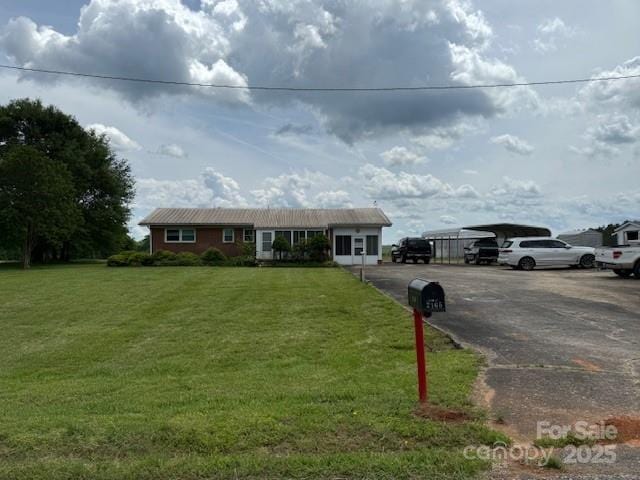 2165 Mccraw Rd, Mooresboro, NC 28114 - single story home with a detached carport and a front lawn