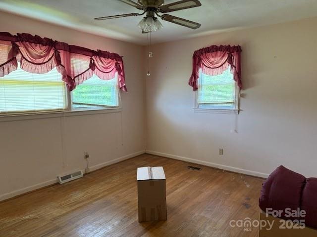 2165 Mccraw Rd, Mooresboro, NC 28114 - unfurnished room with plenty of natural light, wood finished floors, and baseboards