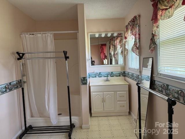 2165 Mccraw Rd, Mooresboro, NC 28114 - bathroom with a shower stall, tile patterned floors, vanity, and baseboards