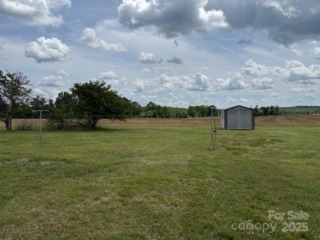 2165 Mccraw Rd, Mooresboro, NC 28114 - view of grassy yard with an outdoor structure and a storage unit
