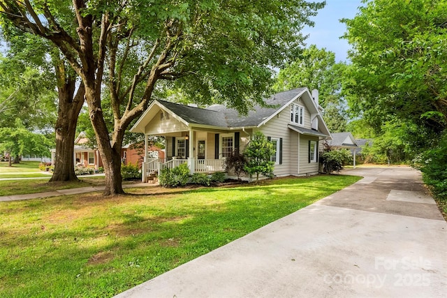 204 S Elm St, Cherryville, NC 28021 - view of front of home with a porch, driveway, and a front lawn