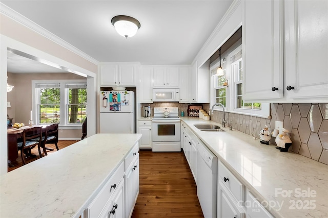 204 S Elm St, Cherryville, NC 28021 - kitchen featuring white appliances, a sink, decorative backsplash, and white cabinetry
