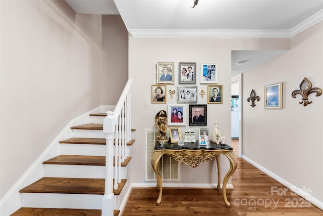 204 S Elm St, Cherryville, NC 28021 - stairway featuring wood finished floors, crown molding, and baseboards