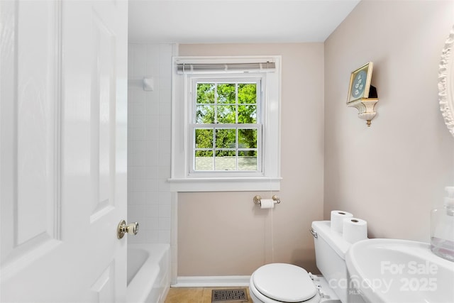 204 S Elm St, Cherryville, NC 28021 - bathroom with toilet, baseboards, tile patterned floors, and shower / bathtub combination
