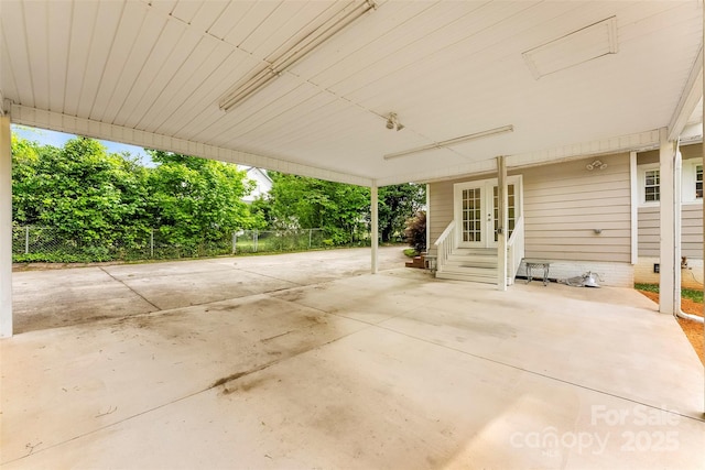 204 S Elm St, Cherryville, NC 28021 - view of patio / terrace with french doors, entry steps, a carport, and fence