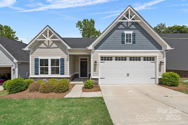 craftsman-style house with driveway, stone siding, an attached garage, and roof with shingles