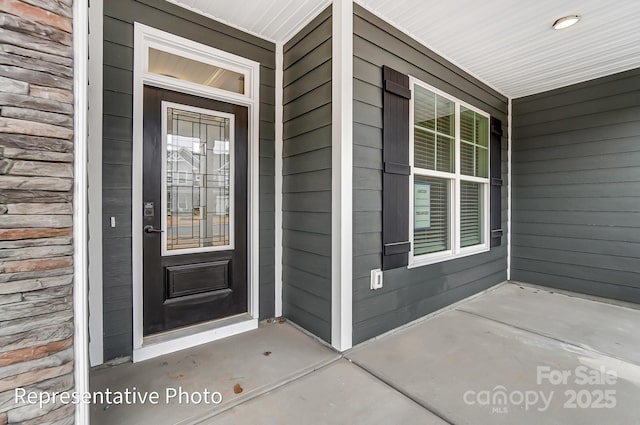 property entrance featuring a porch