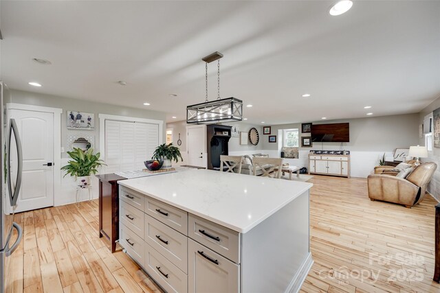 3091 Old Meeting House Rd, Sharon, SC 29742 - kitchen featuring light wood finished floors, a center island, stainless steel refrigerator, light countertops, and recessed lighting