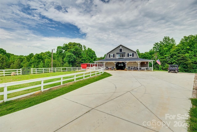 3091 Old Meeting House Rd, Sharon, SC 29742 - view of front facade featuring a porch, a gambrel roof, and a wooded view