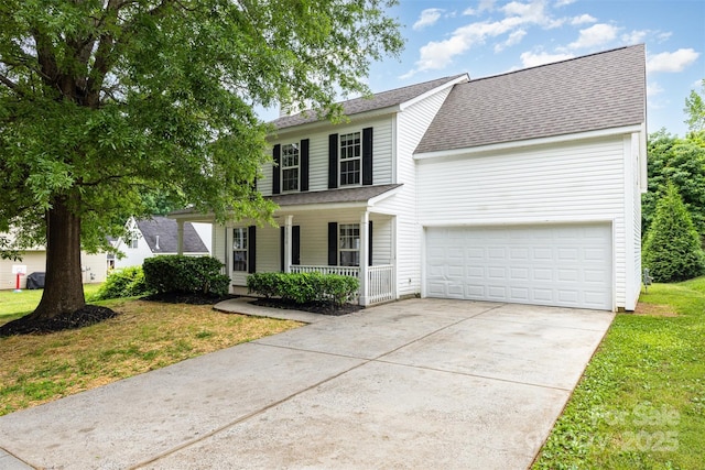 3312 James Rd, Charlotte, NC 28215 - view of front of home with a porch, concrete driveway, a shingled roof, and a front yard