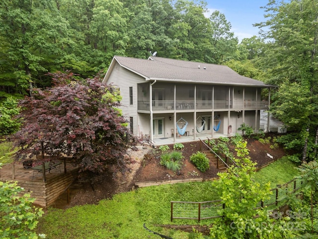 273 Bluebird Rd, Lake Lure, NC 28746 - rear view of house with a patio, a sunroom, a vegetable garden, and fence