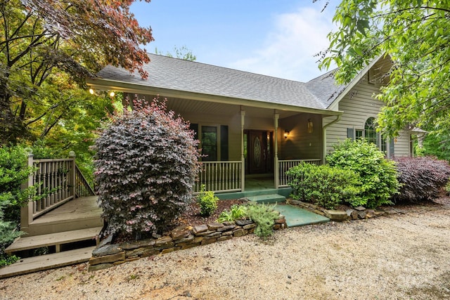 273 Bluebird Rd, Lake Lure, NC 28746 - view of front of house with covered porch and roof with shingles