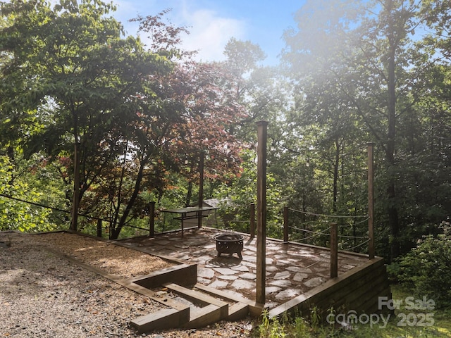 273 Bluebird Rd, Lake Lure, NC 28746 - wooden deck featuring a fire pit