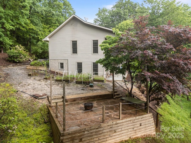 273 Bluebird Rd, Lake Lure, NC 28746 - back of house featuring a vegetable garden