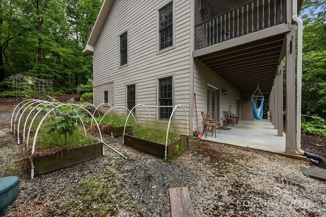 273 Bluebird Rd, Lake Lure, NC 28746 - view of property exterior featuring a vegetable garden and a patio area