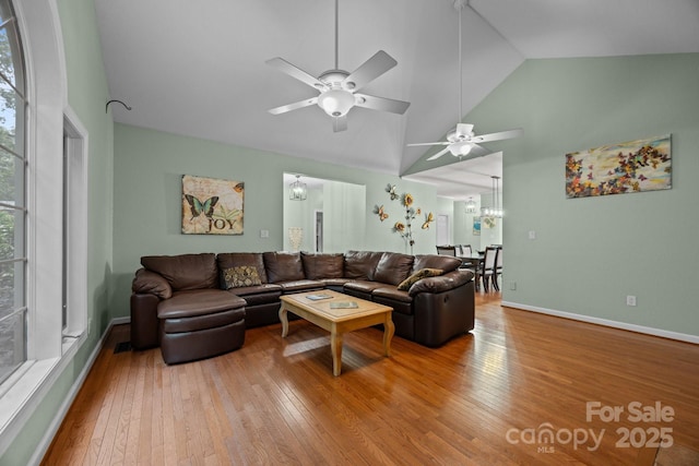 273 Bluebird Rd, Lake Lure, NC 28746 - living area with a ceiling fan, hardwood / wood-style floors, a chandelier, high vaulted ceiling, and baseboards