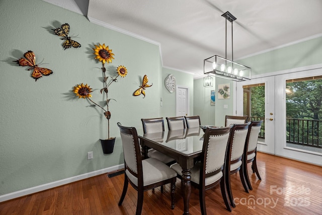 273 Bluebird Rd, Lake Lure, NC 28746 - dining space with ornamental molding, wood finished floors, baseboards, french doors, and a chandelier