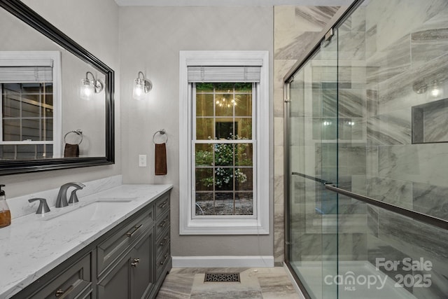 273 Bluebird Rd, Lake Lure, NC 28746 - bathroom featuring a shower stall, baseboards, and vanity