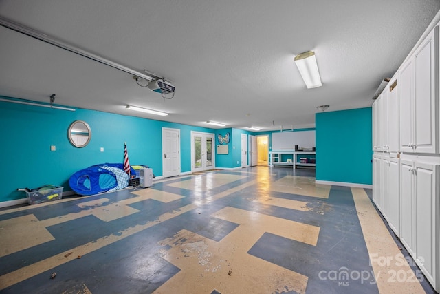 273 Bluebird Rd, Lake Lure, NC 28746 - garage featuring french doors and a garage door opener