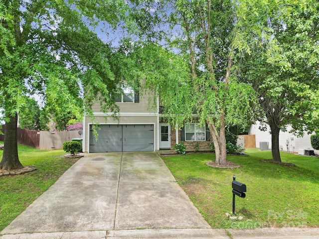 2117 Seabrook Ln, Fort Mill, SC 29715 - view of property hidden behind natural elements featuring a garage, concrete driveway, and brick siding