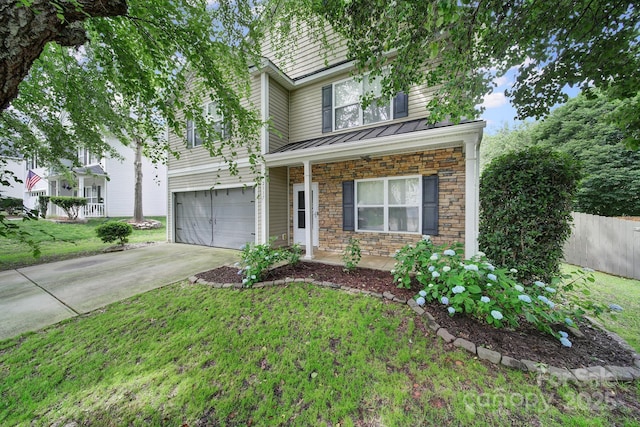 2117 Seabrook Ln, Fort Mill, SC 29715 - view of front of home with stone siding, a standing seam roof, an attached garage, concrete driveway, and covered porch