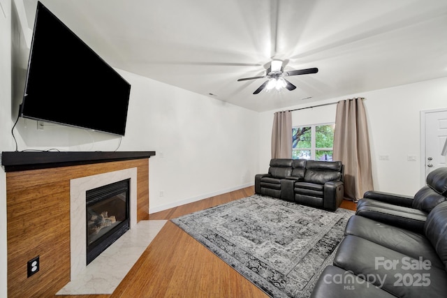 2117 Seabrook Ln, Fort Mill, SC 29715 - living area with wood finished floors, a ceiling fan, and a high end fireplace