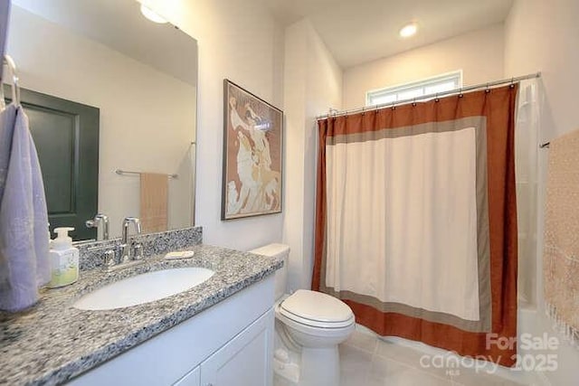bathroom with a shower with shower curtain, tile patterned flooring, toilet, and vanity