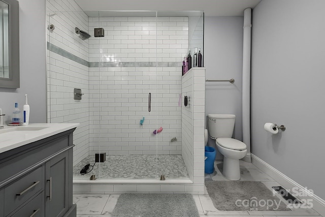 bathroom featuring marble look tiles, a shower stall, toilet, vanity, and baseboards