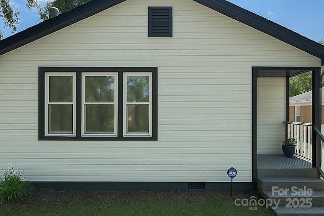 view of home's exterior featuring crawl space