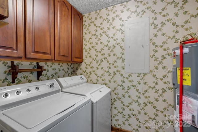 clothes washing area with cabinet space, wallpapered walls, independent washer and dryer, electric panel, and electric water heater