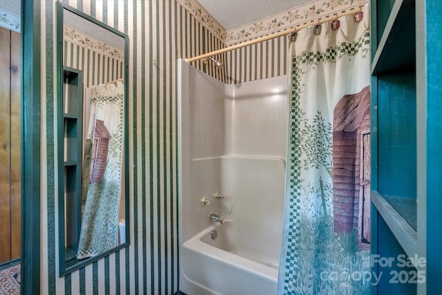 full bathroom with wallpapered walls and shower / bath combo