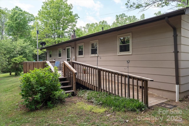 back of house with a wooden deck