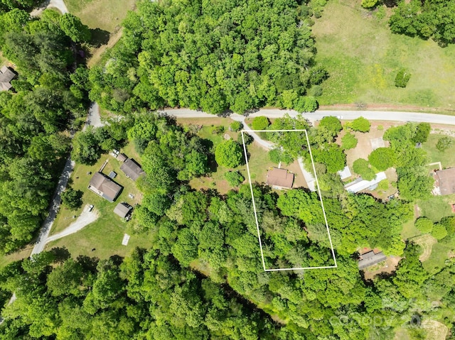 aerial view of property and surrounding area with property boundaries highlighted