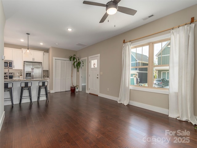41 Wheeler Rd, Weaverville, NC 28787 - unfurnished living room with baseboards, dark wood-type flooring, recessed lighting, and ceiling fan