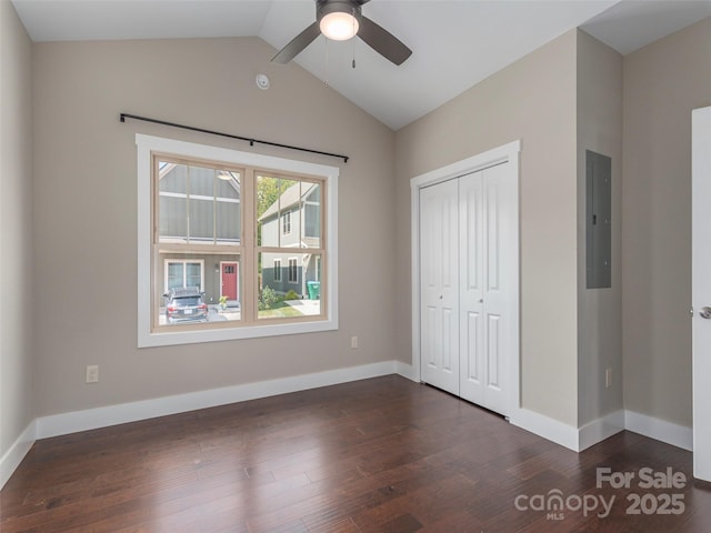 41 Wheeler Rd, Weaverville, NC 28787 - unfurnished bedroom featuring dark wood finished floors, electric panel, a closet, lofted ceiling, and baseboards