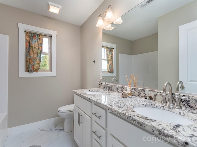 41 Wheeler Rd, Weaverville, NC 28787 - bathroom featuring healthy amount of natural light, baseboards, toilet, and marble finish flooring