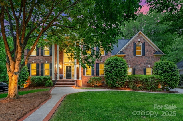 7812 Seton House Ln, Charlotte, NC 28277 - view of front of home with brick siding and a front yard
