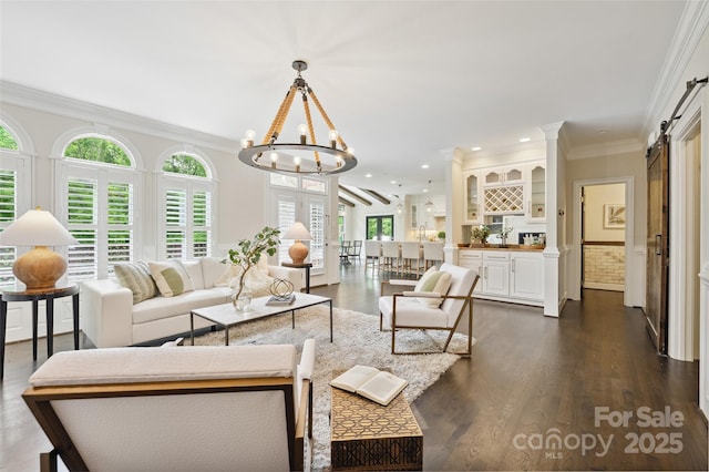 7812 Seton House Ln, Charlotte, NC 28277 - living room with a chandelier, recessed lighting, ornamental molding, dark wood-style floors, and a barn door