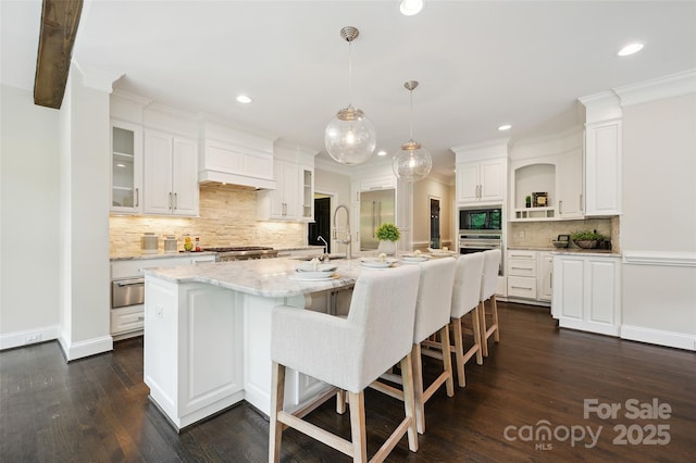 7812 Seton House Ln, Charlotte, NC 28277 - kitchen with open shelves, appliances with stainless steel finishes, backsplash, custom exhaust hood, and white cabinets