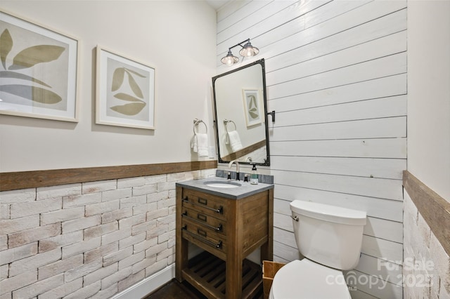 7812 Seton House Ln, Charlotte, NC 28277 - half bath with toilet, vanity, a wainscoted wall, and wood walls