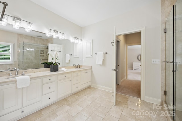 7812 Seton House Ln, Charlotte, NC 28277 - bathroom with a stall shower, double vanity, tile patterned flooring, and baseboards