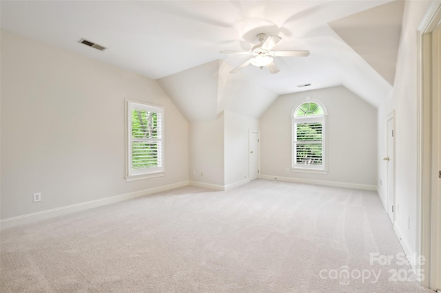 7812 Seton House Ln, Charlotte, NC 28277 - additional living space featuring light colored carpet, a ceiling fan, baseboards, and vaulted ceiling