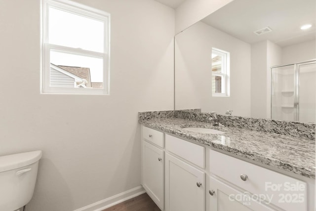 3342 Strong Box Ln, Gastonia, NC 28052 - bathroom featuring baseboards, vanity, toilet, a shower with shower door, and wood finished floors