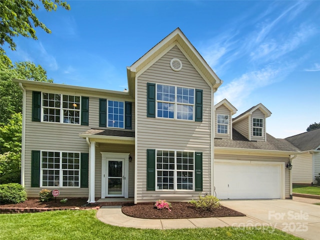 10406 Baskerville Ave, Charlotte, NC 28269 - traditional-style house with concrete driveway, an attached garage, and a front yard