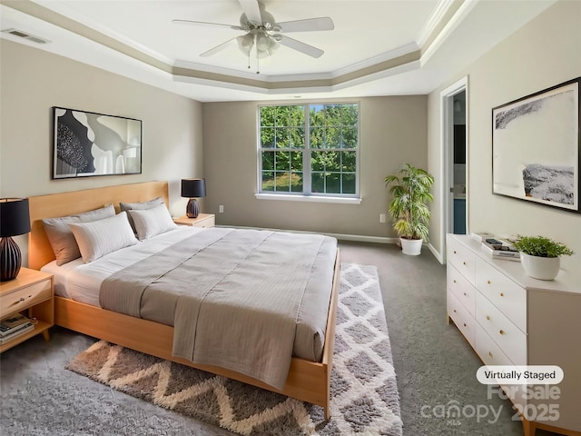 10406 Baskerville Ave, Charlotte, NC 28269 - carpeted bedroom featuring a raised ceiling, crown molding, ceiling fan, and baseboards