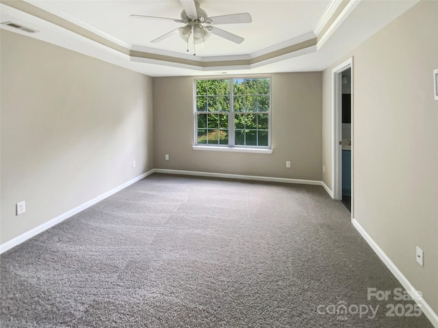 10406 Baskerville Ave, Charlotte, NC 28269 - unfurnished room with a raised ceiling, ornamental molding, carpet, a ceiling fan, and baseboards