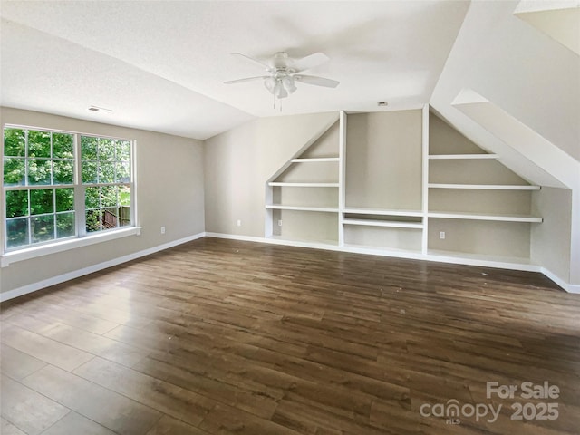 10406 Baskerville Ave, Charlotte, NC 28269 - bonus room featuring wood finished floors, a ceiling fan, baseboards, and vaulted ceiling